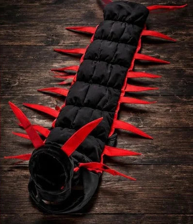 The Centipede Cat Costume laid flat, showing its padded sections and red legs