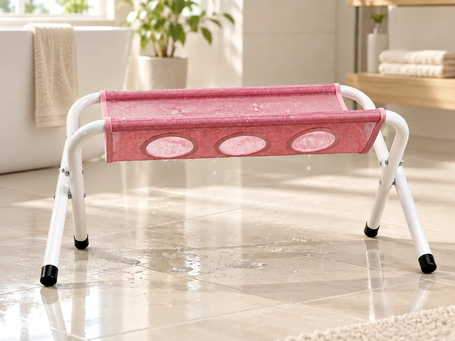 Water draining from the mesh surface of the Pawlie Cat Bath Stand