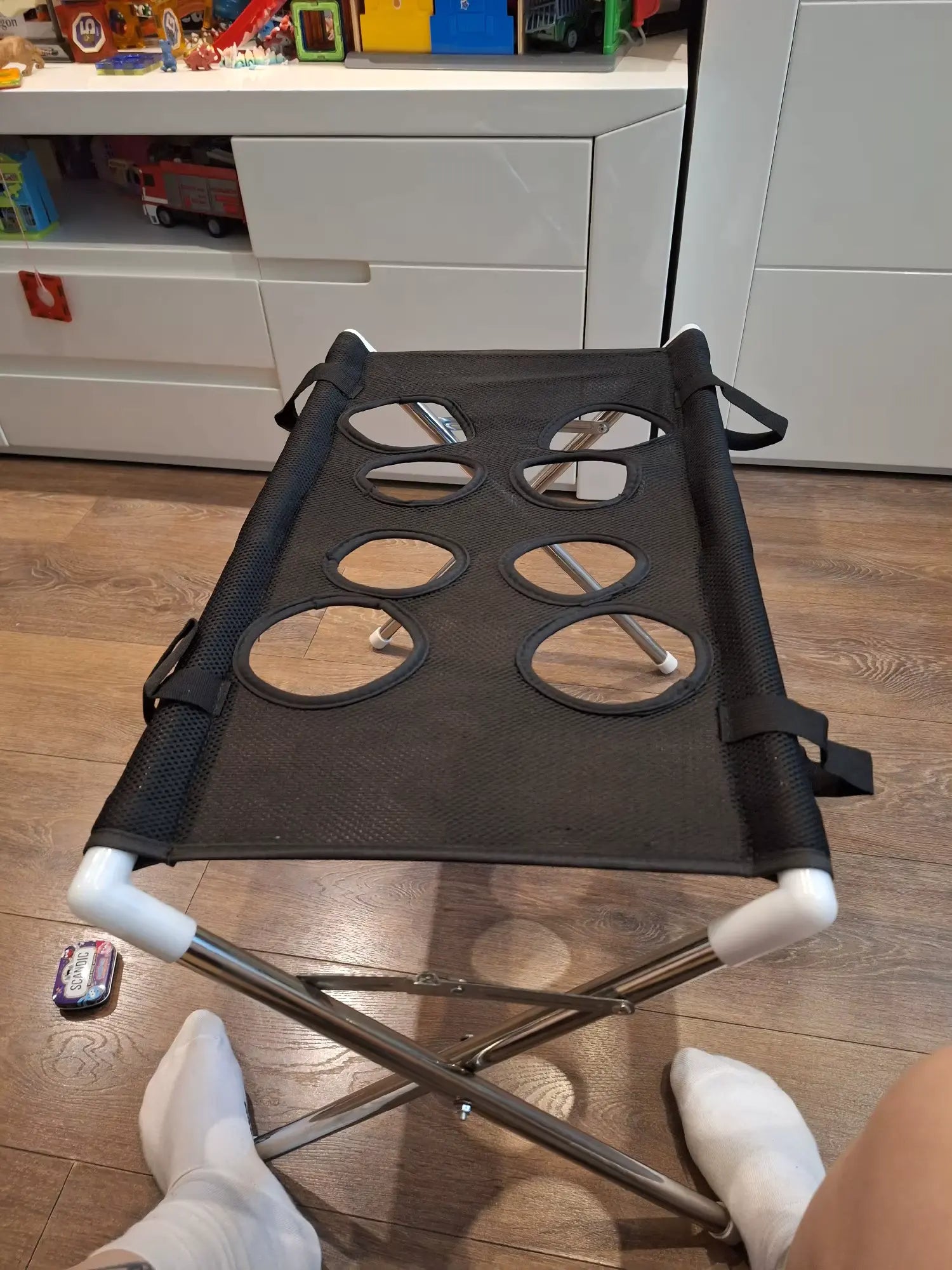 Customer photo of a black Pawlie grooming stand at home