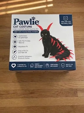 Pawlie Cat Costume box on a wooden floor